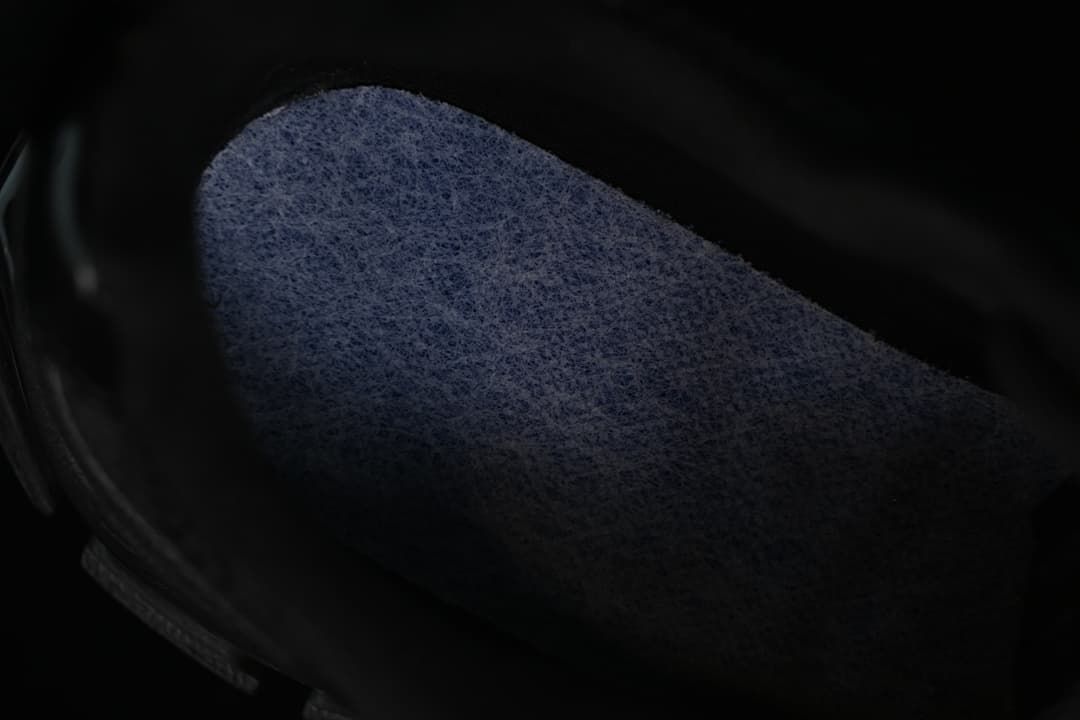 Close-up of the dark inner lining of the sneaker.