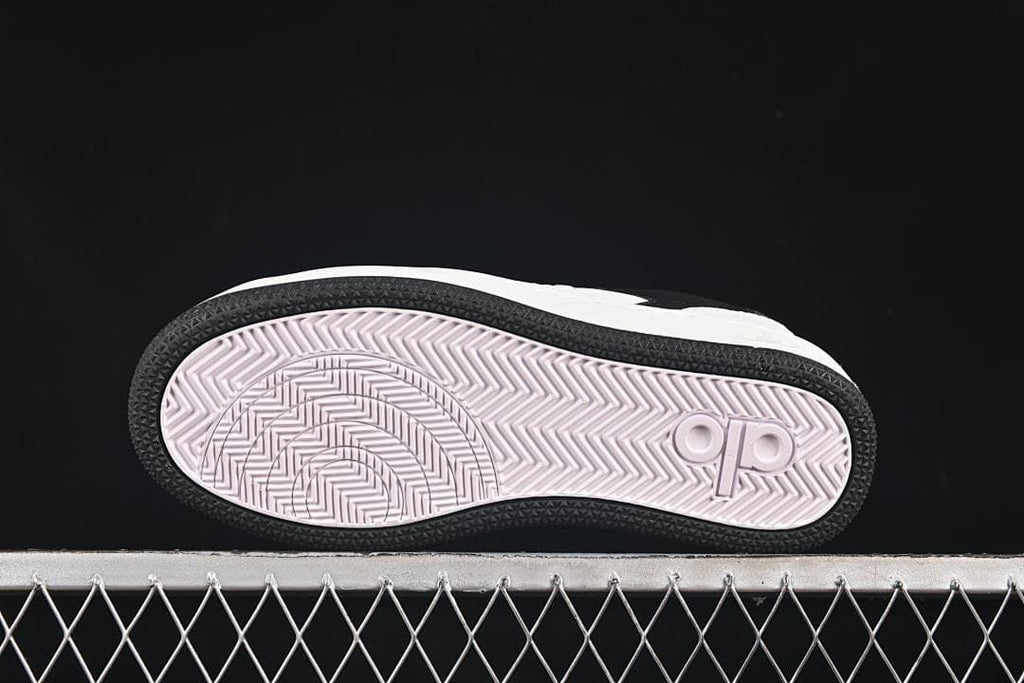 Underside view showing the patterned outsole and logo detail