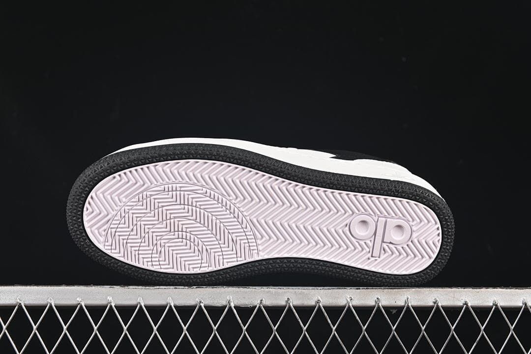 Underside view showing the patterned outsole and logo detail