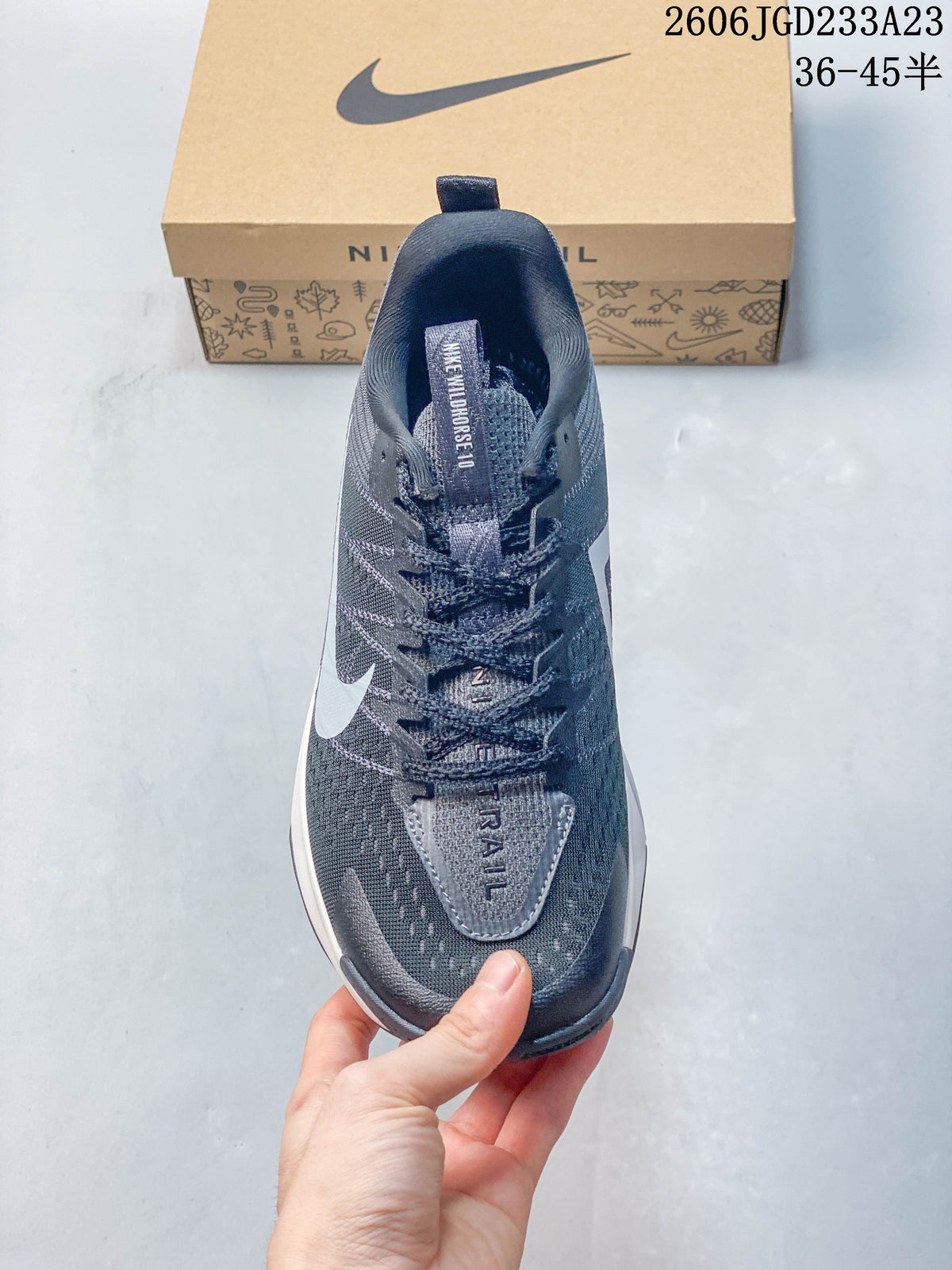 Top view showing the laces, tongue, and gray upper of the Nike Wildhorse 10