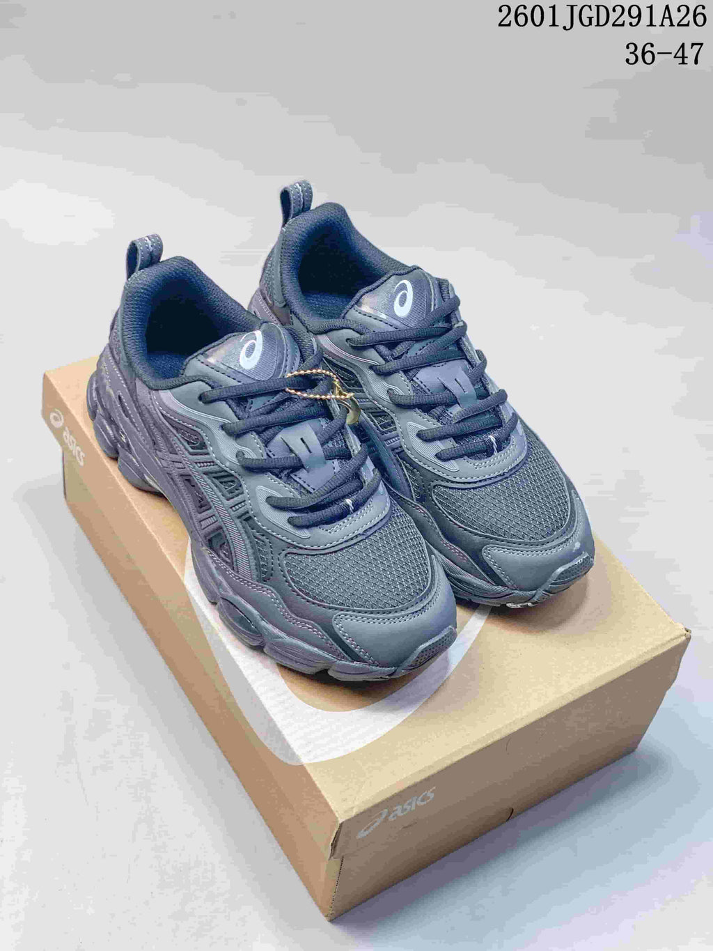 Dark gray ASICS GEL-NYC RGD sneakers shown as a pair