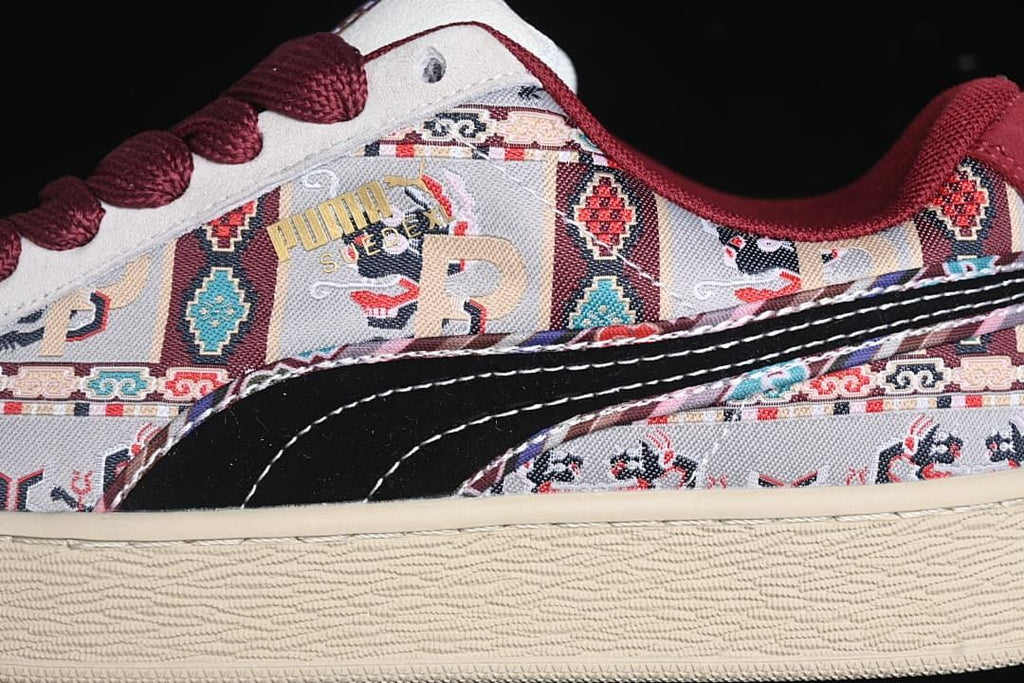 Close-up of patterned side panels, black side formstrip, and cream sole