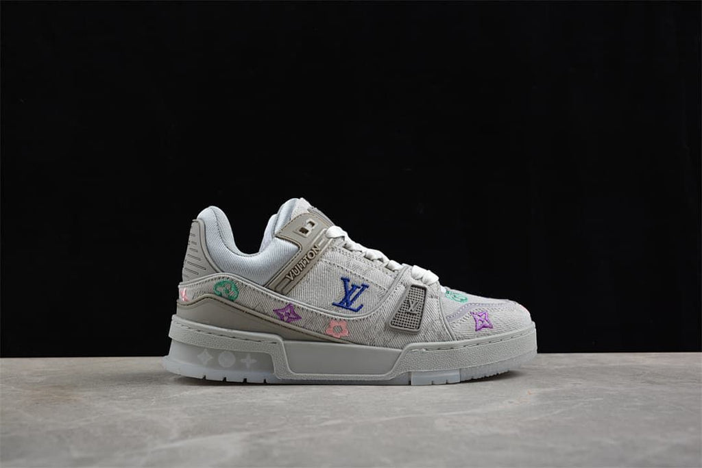 Side view highlighting the gray upper and colorful embroidery