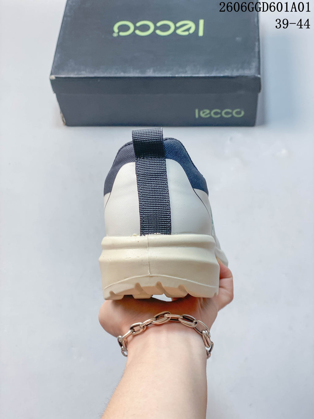 Rear view of the sneaker showing the heel pull tab and layered sole