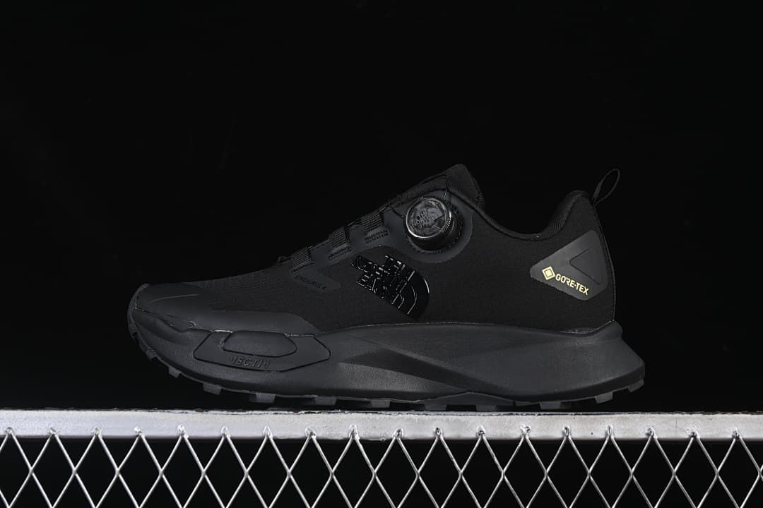 Side view of a black The North Face Vectiv Enduris Low shoe with dial-style closure and GORE-TEX branding.