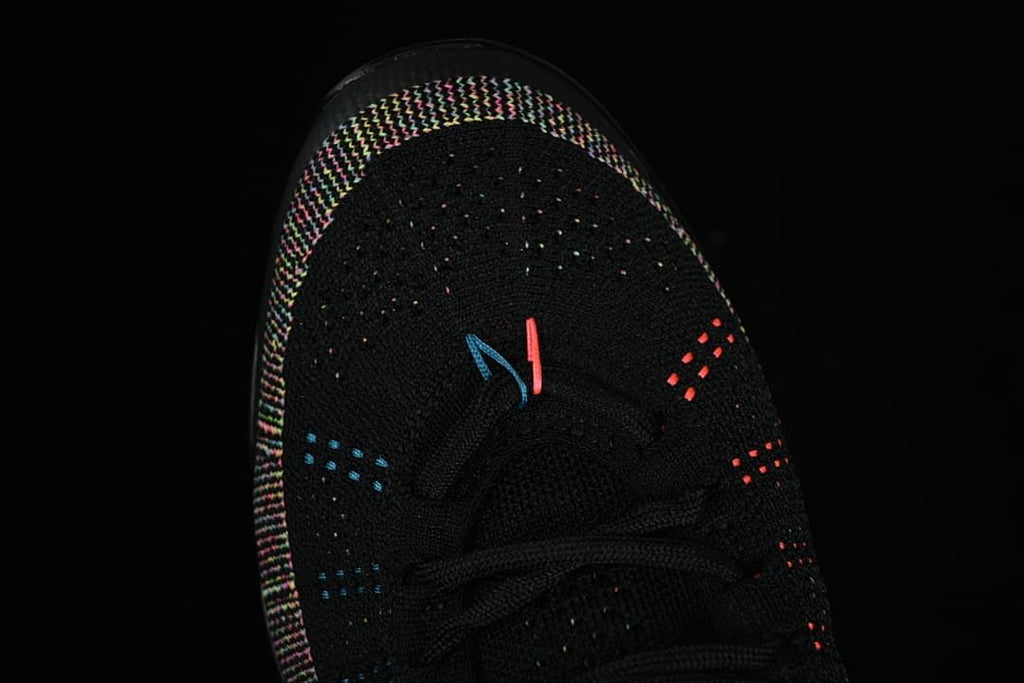 Top view of the black knit sneaker toe and laces