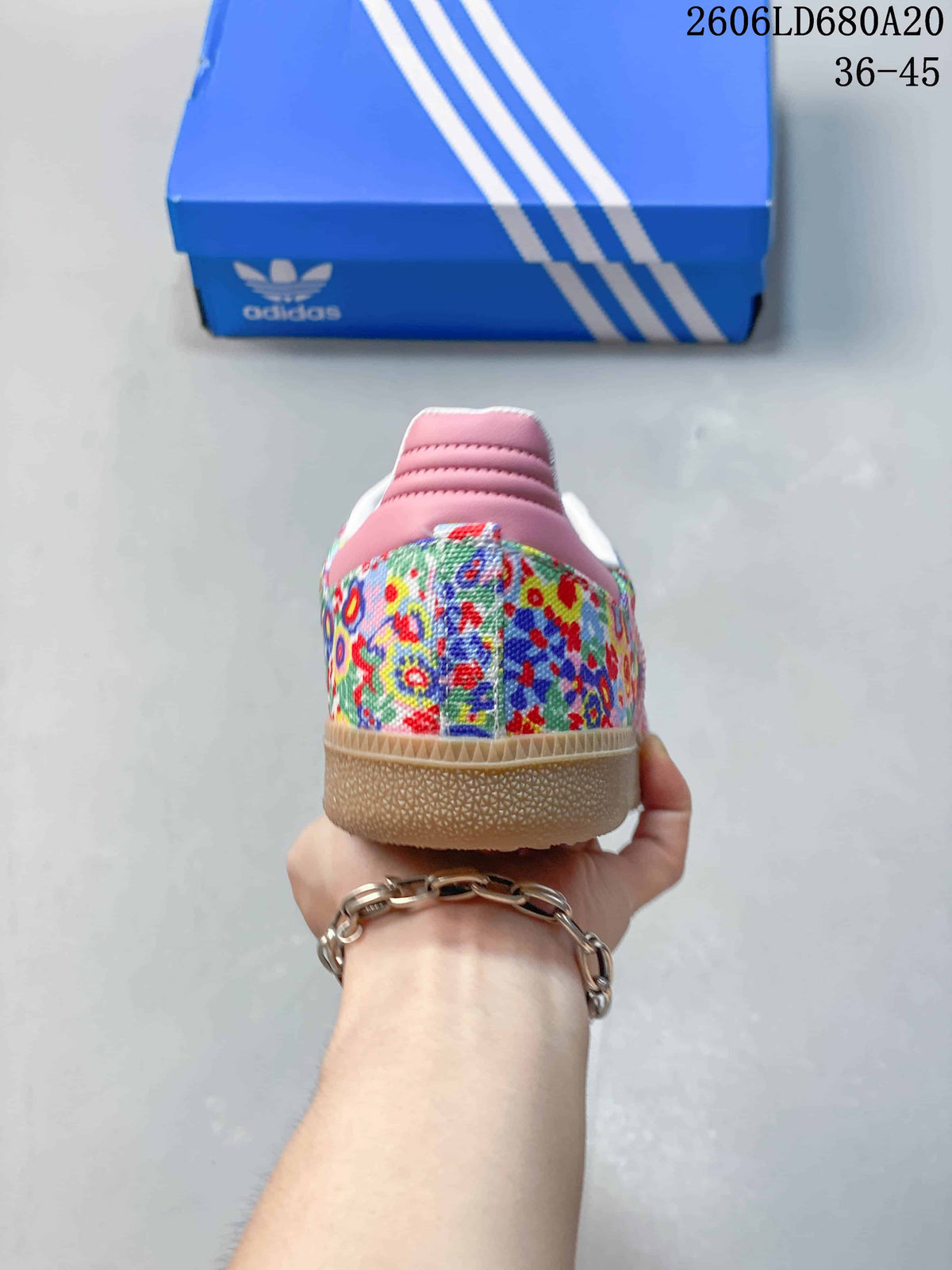 Rear view showing the floral heel panels and pink heel trim