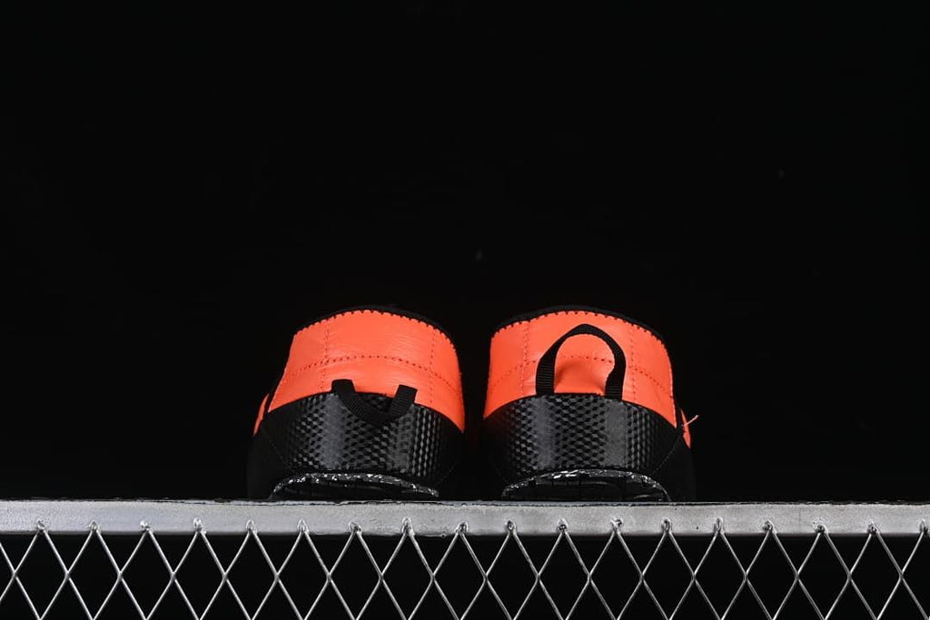 Rear view of both mules showing their heel pull tabs