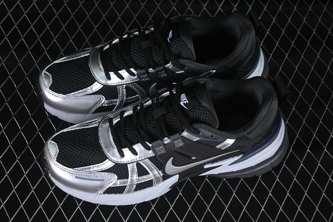 Pair of black, silver, and white low-top shoes viewed from above