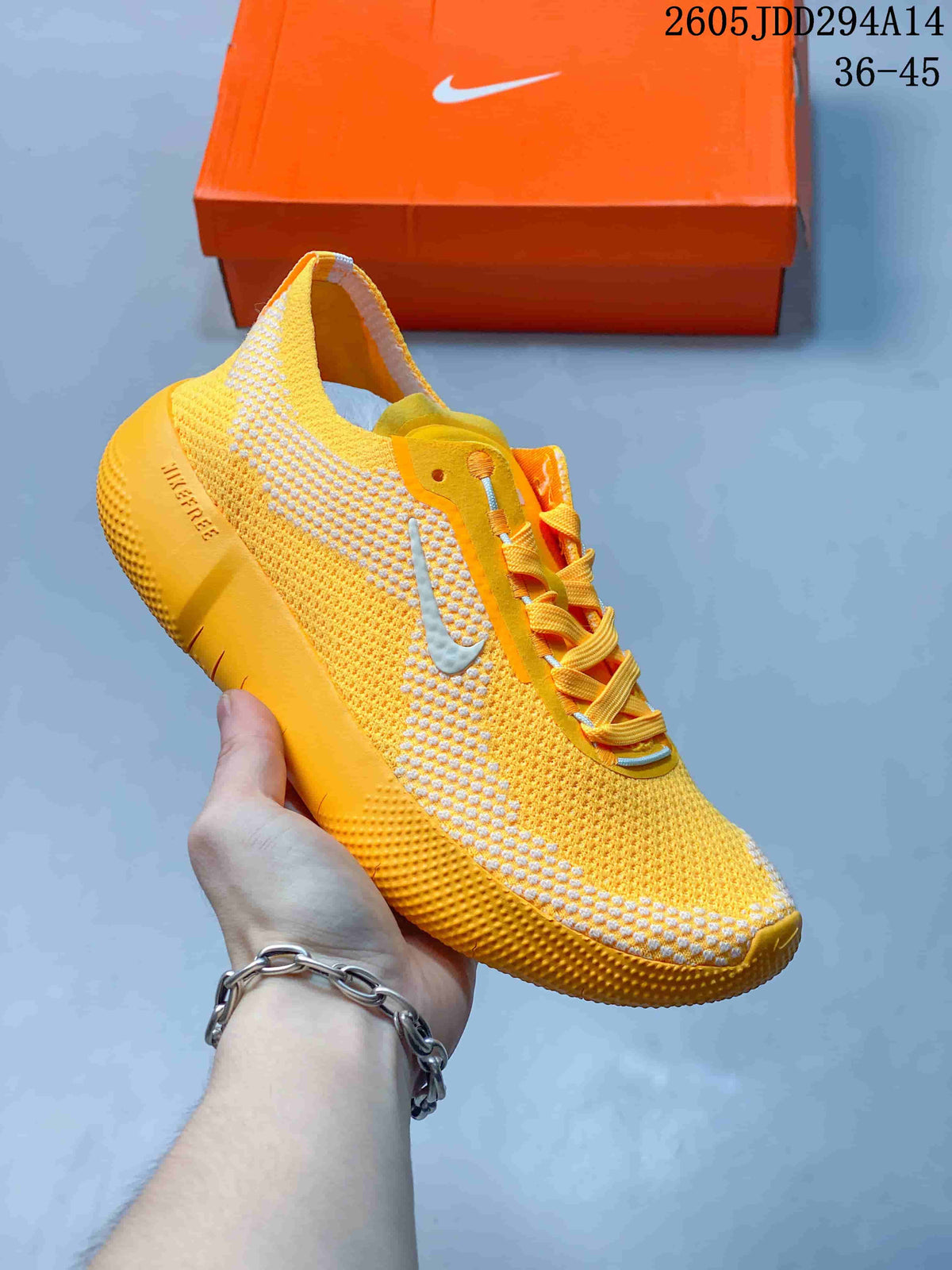 Yellow Nike Free low-top sneaker with white accents.