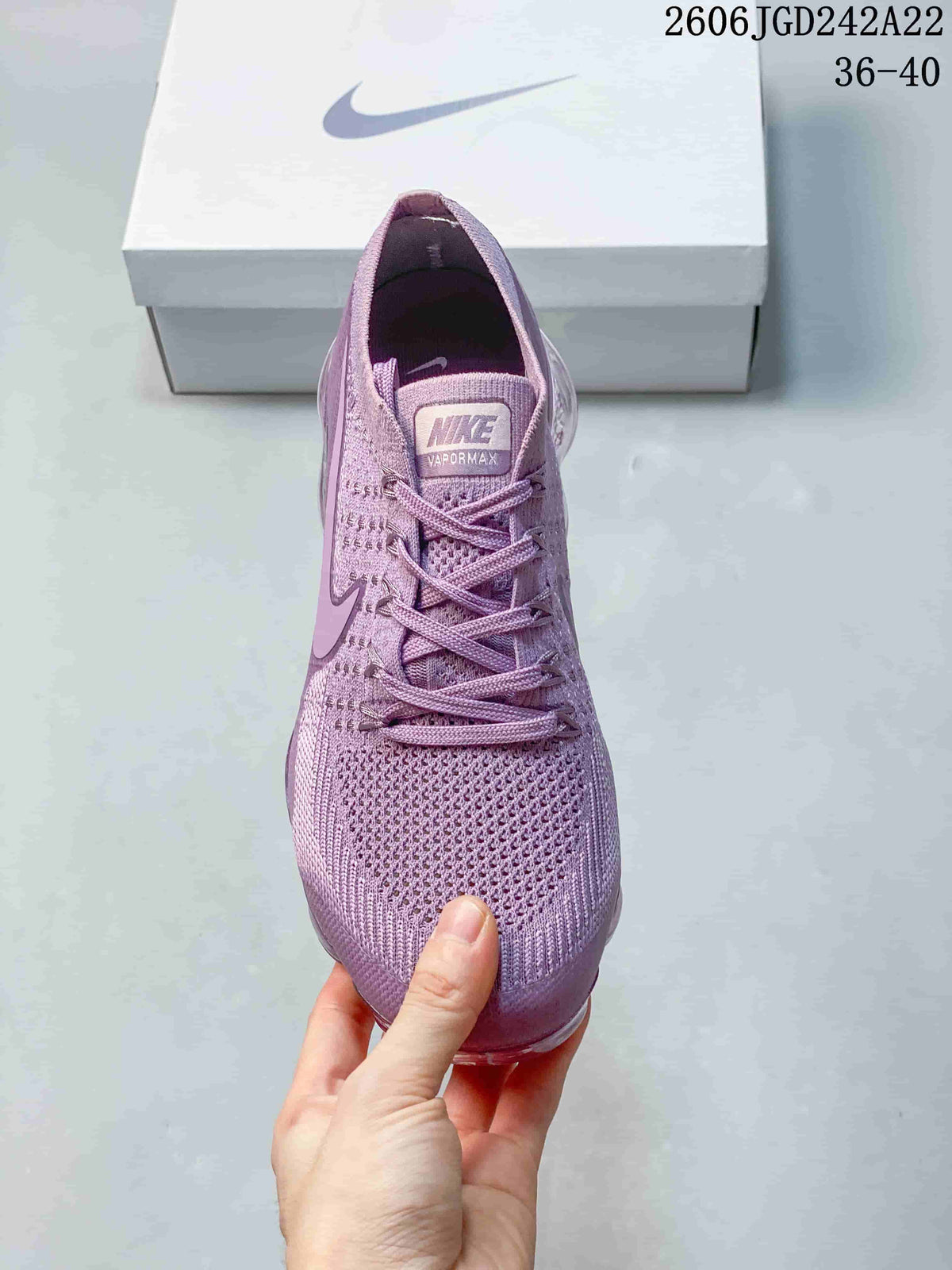 Front view of a purple lace-up sneaker with a knit-style upper; image displays the size range 36–40.