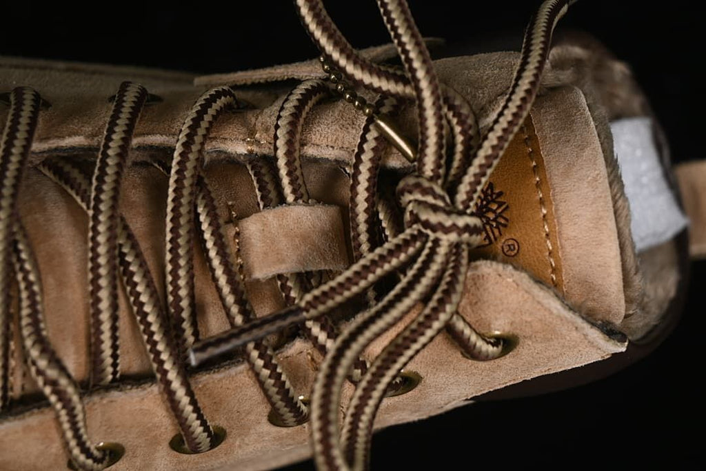 Close-up of the boot laces, metal-tone eyelets and tongue