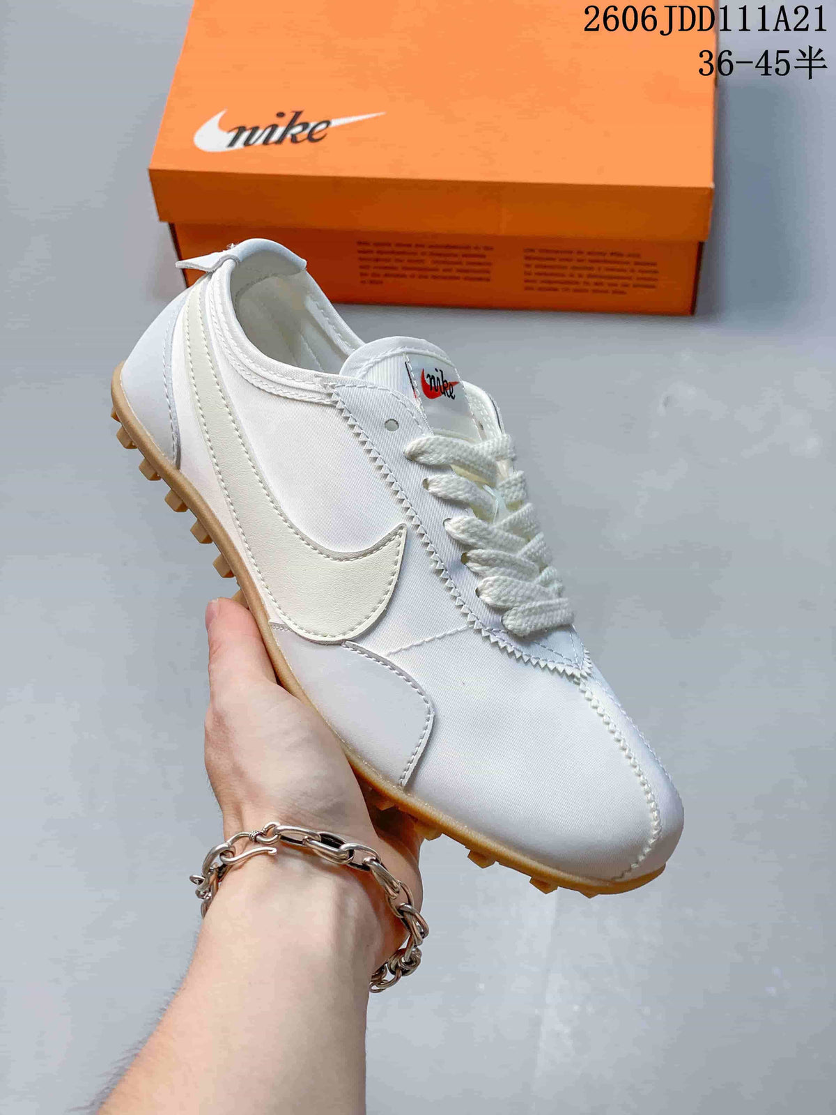 White Nike Moon Shoe OG Summit low-top sneaker with a white Swoosh and gum-colored outsole