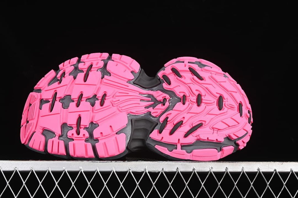 Underside view showing the pink tread pattern