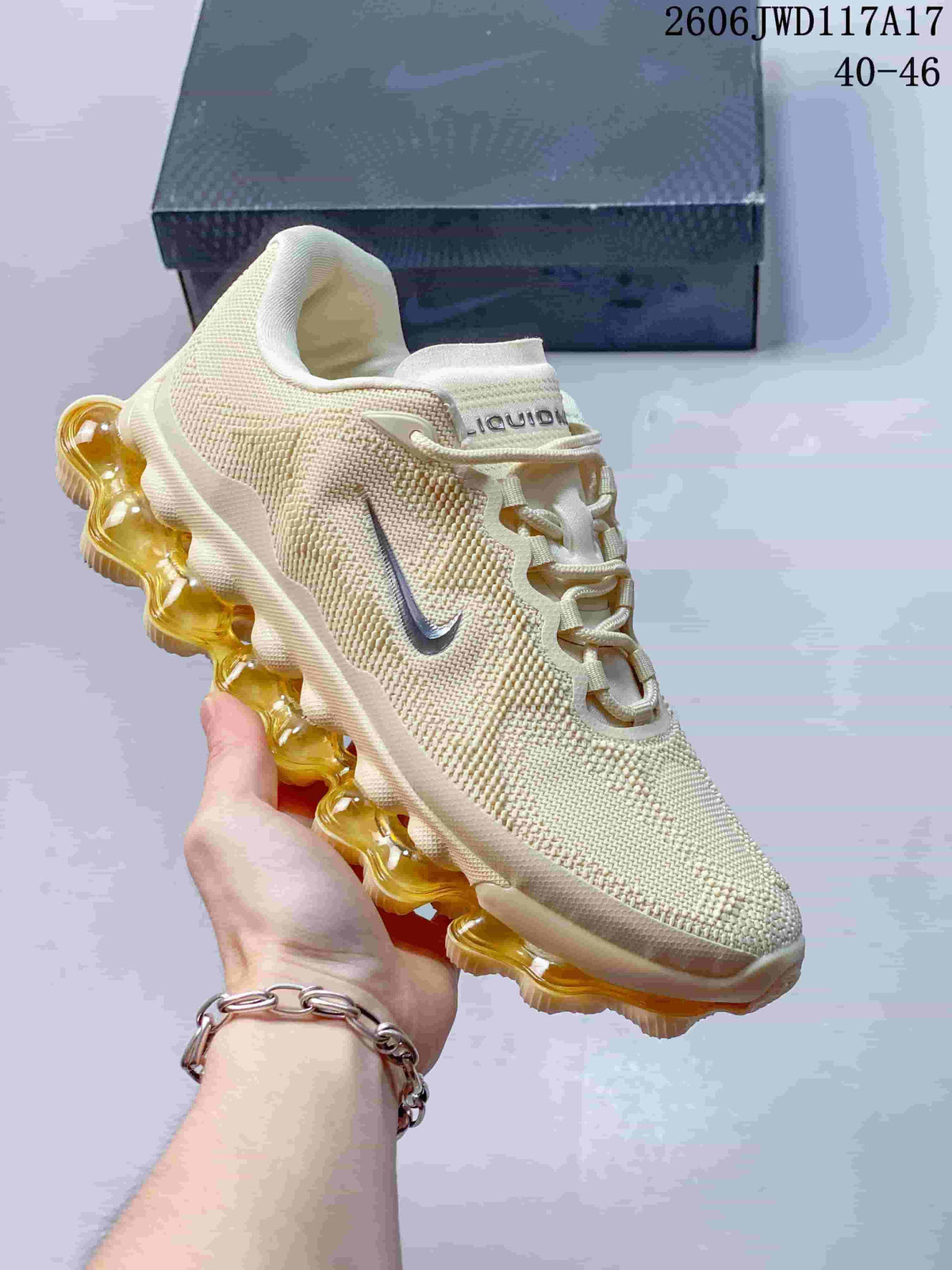 Several colorways of low-top Nike Air Liquid Max sneakers arranged in a circle