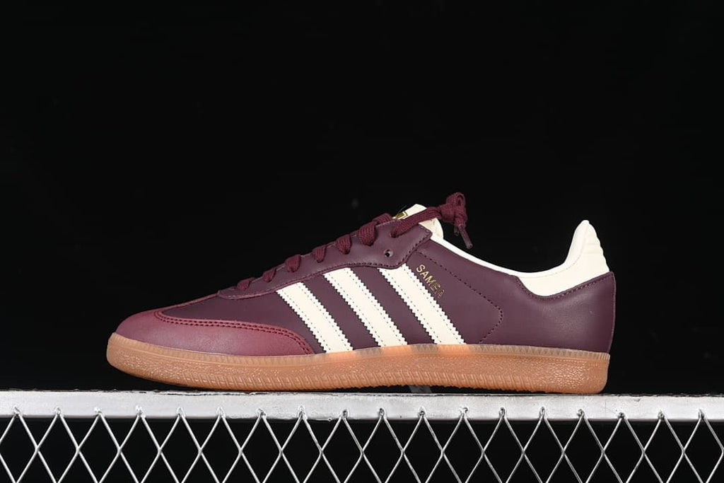Side view of the burgundy and cream adidas Samba OG with gum-colored sole
