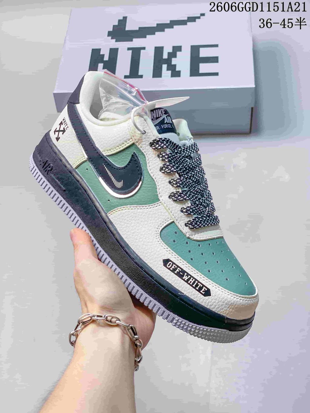 Angled side view of the sneakers with contrasting panels and graphic details