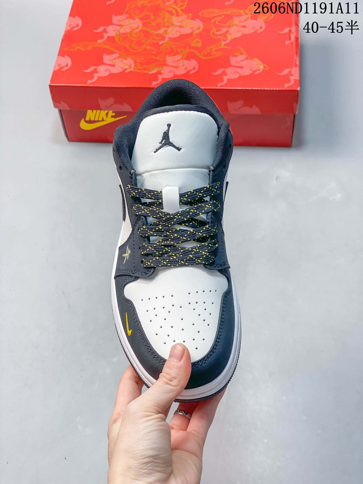 Front view showing the perforated white toe, patterned laces, and navy overlays
