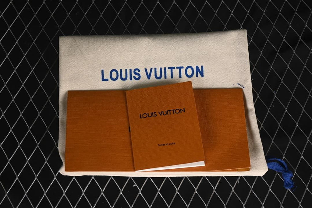 Branded fabric pouch and printed booklet shown with the shoe