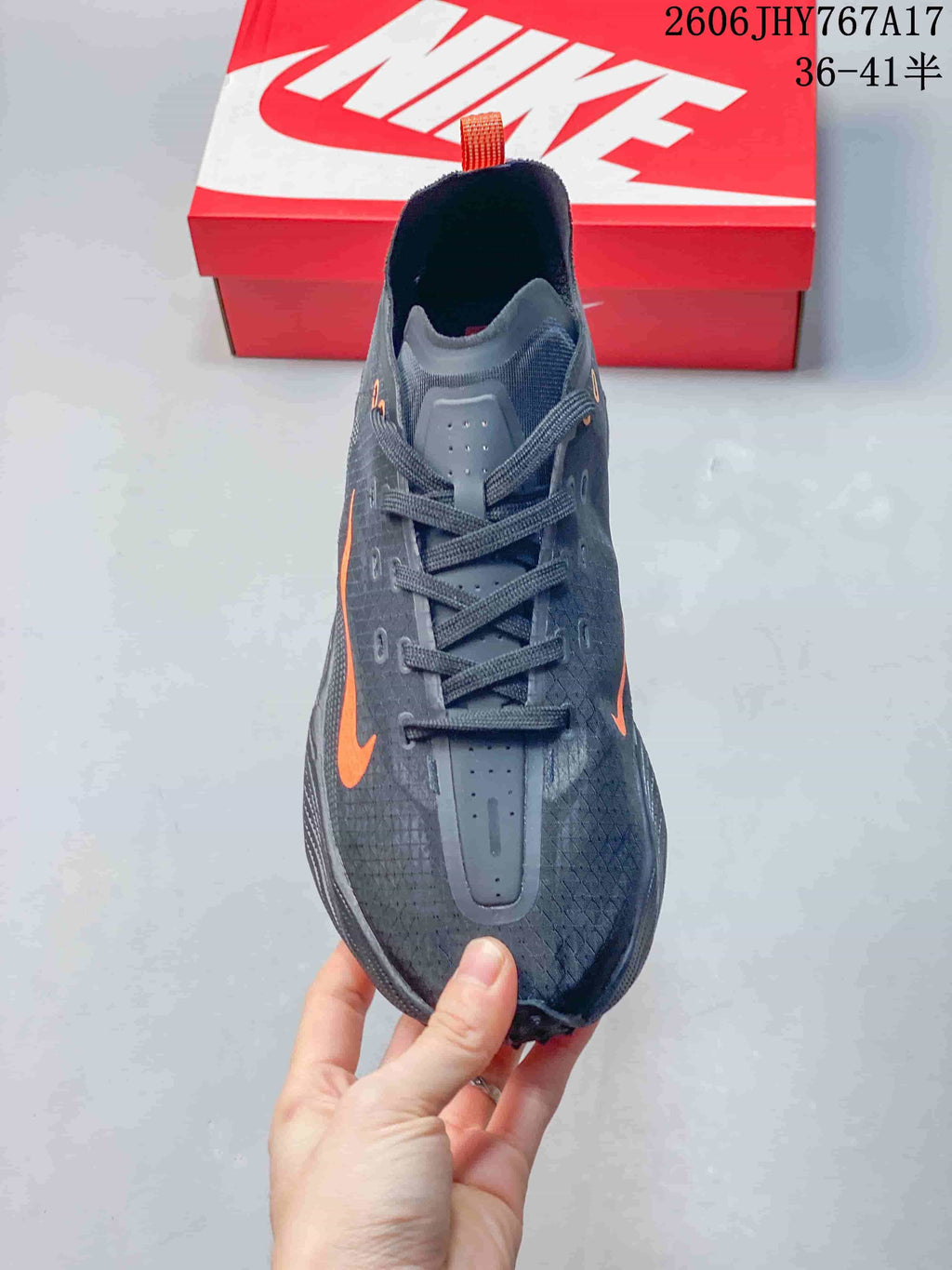 Front view showing the lace-up closure and textured upper of a Nike Ava Rover sneaker.