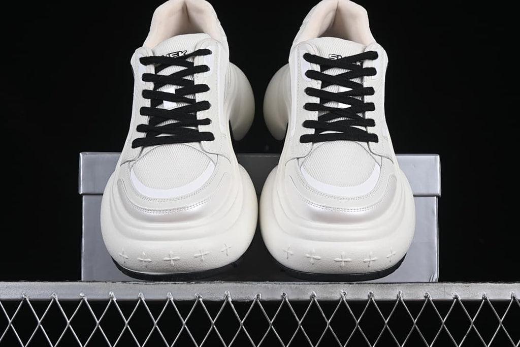 Front view of the pair showing the layered toes and thick soles