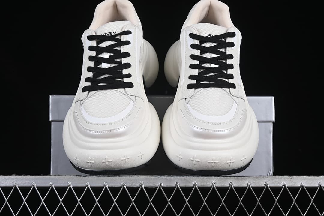 Front view of the pair showing the layered toes and thick soles