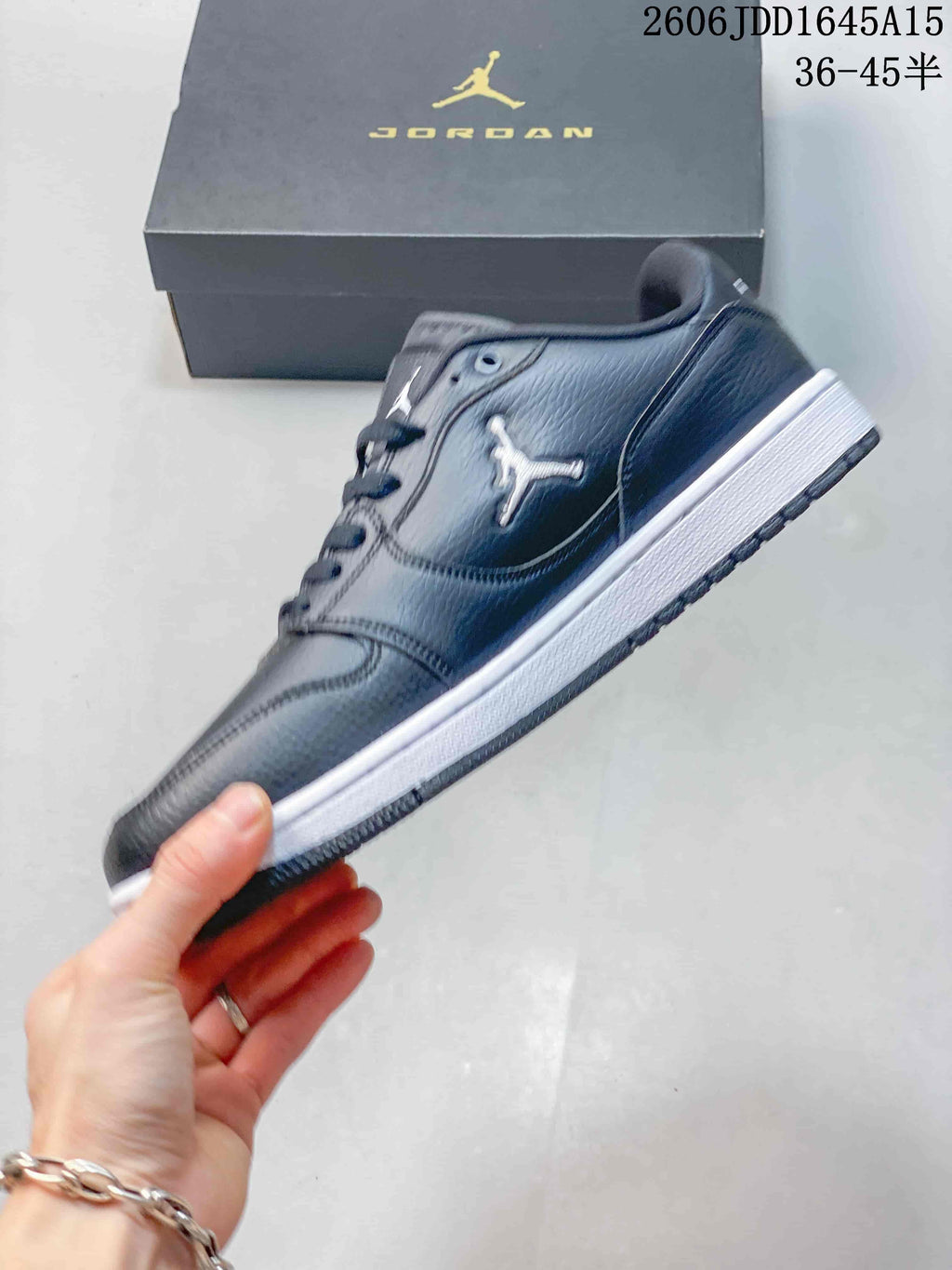 Side profile of a dark grey Jordan Court Connect low-top sneaker