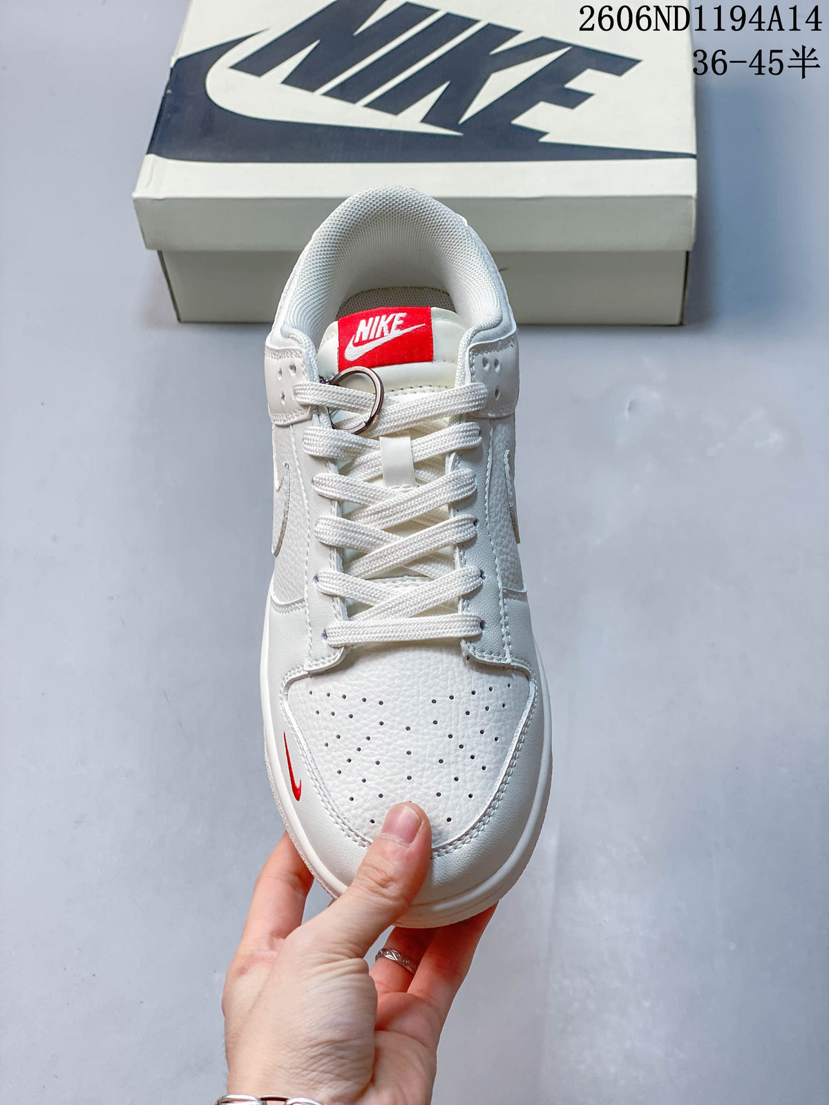 Top view showing the perforated toe, white laces and red tongue label