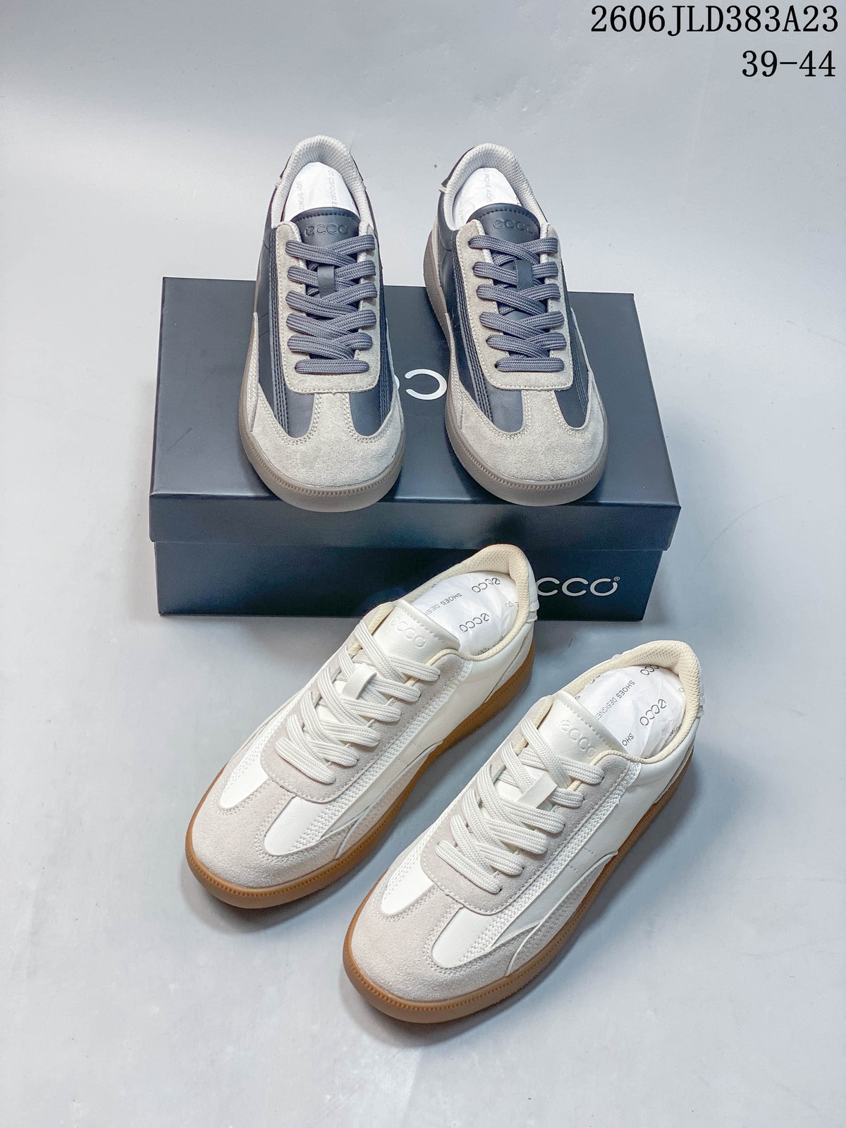 Gray and navy and cream ECCO low-top sneakers shown together