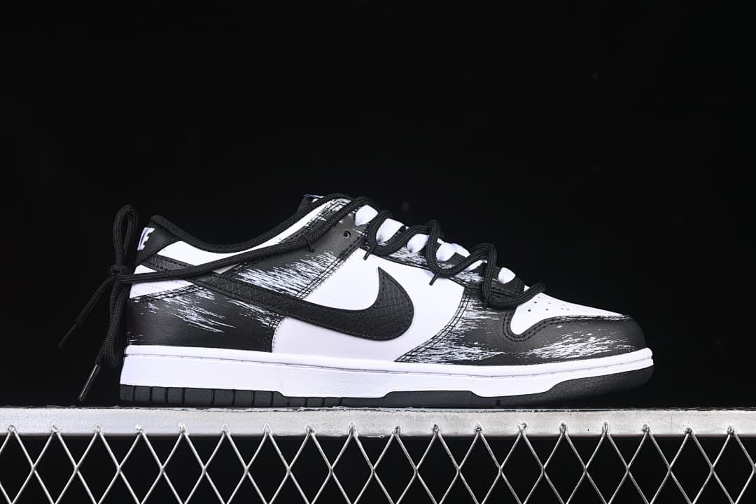 Side profile showing the low-top silhouette and brushstroke graphics