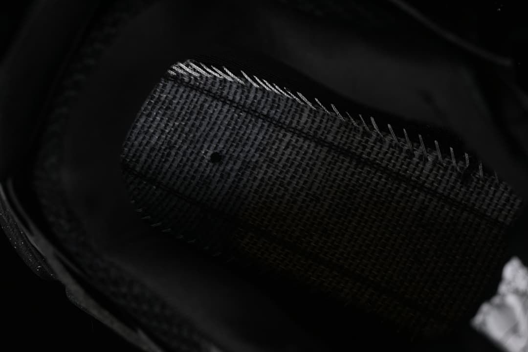 Close-up view inside the black sneaker.