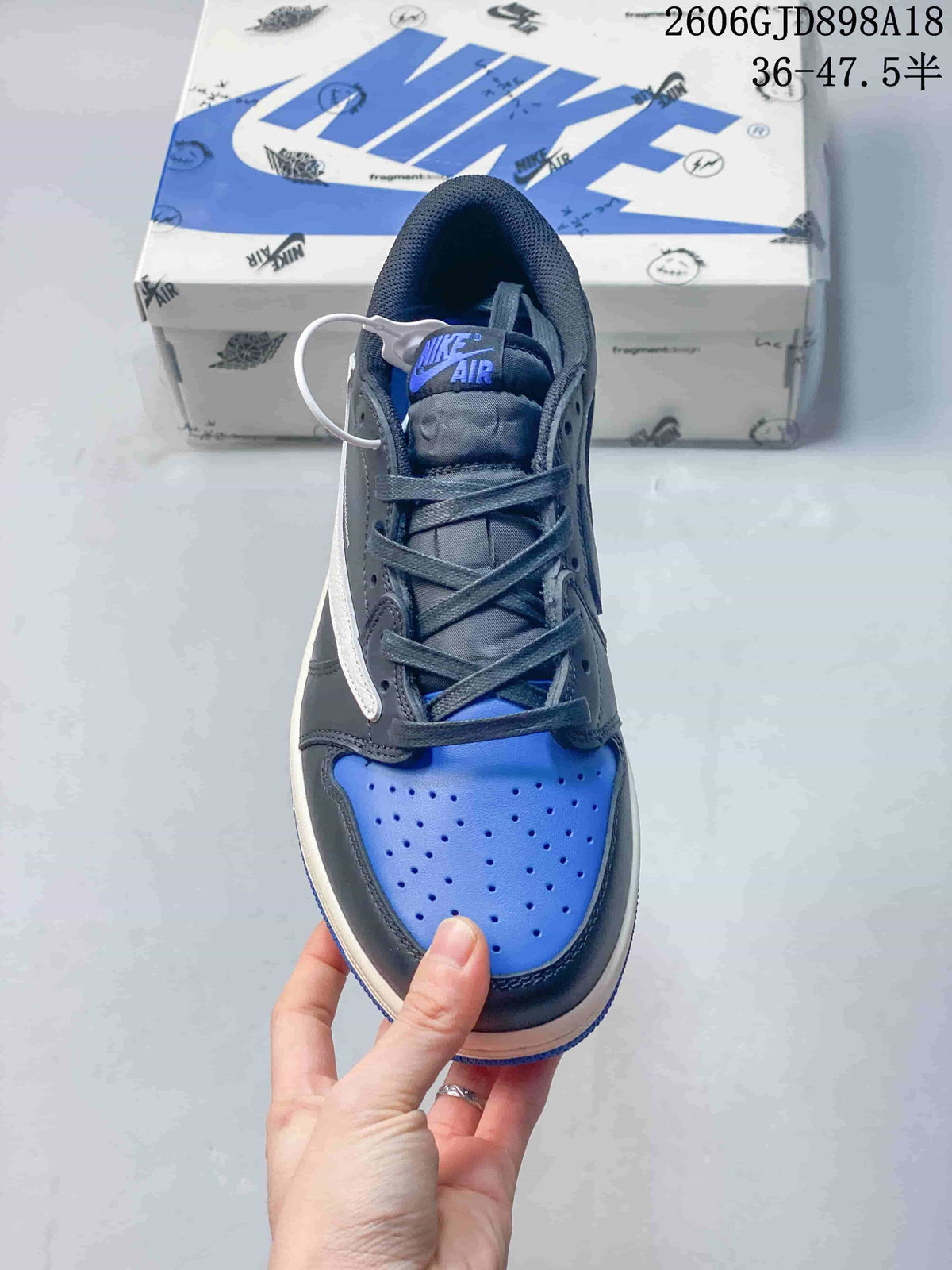 Top view of a blue and dark gray lace-up sneaker