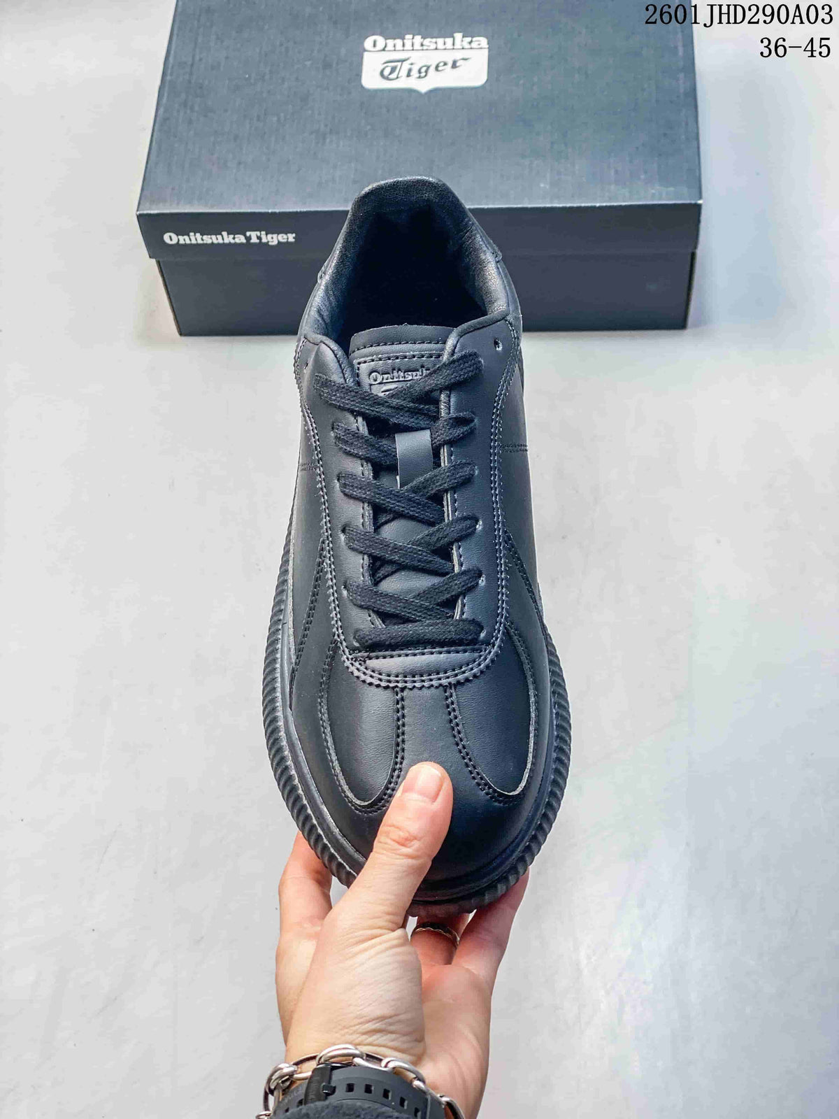 Front view of the lace-up sneaker showing its panel details