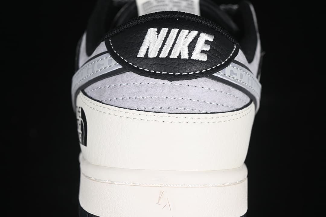 Rear view showing Nike heel branding, grey panels, and The North Face detail