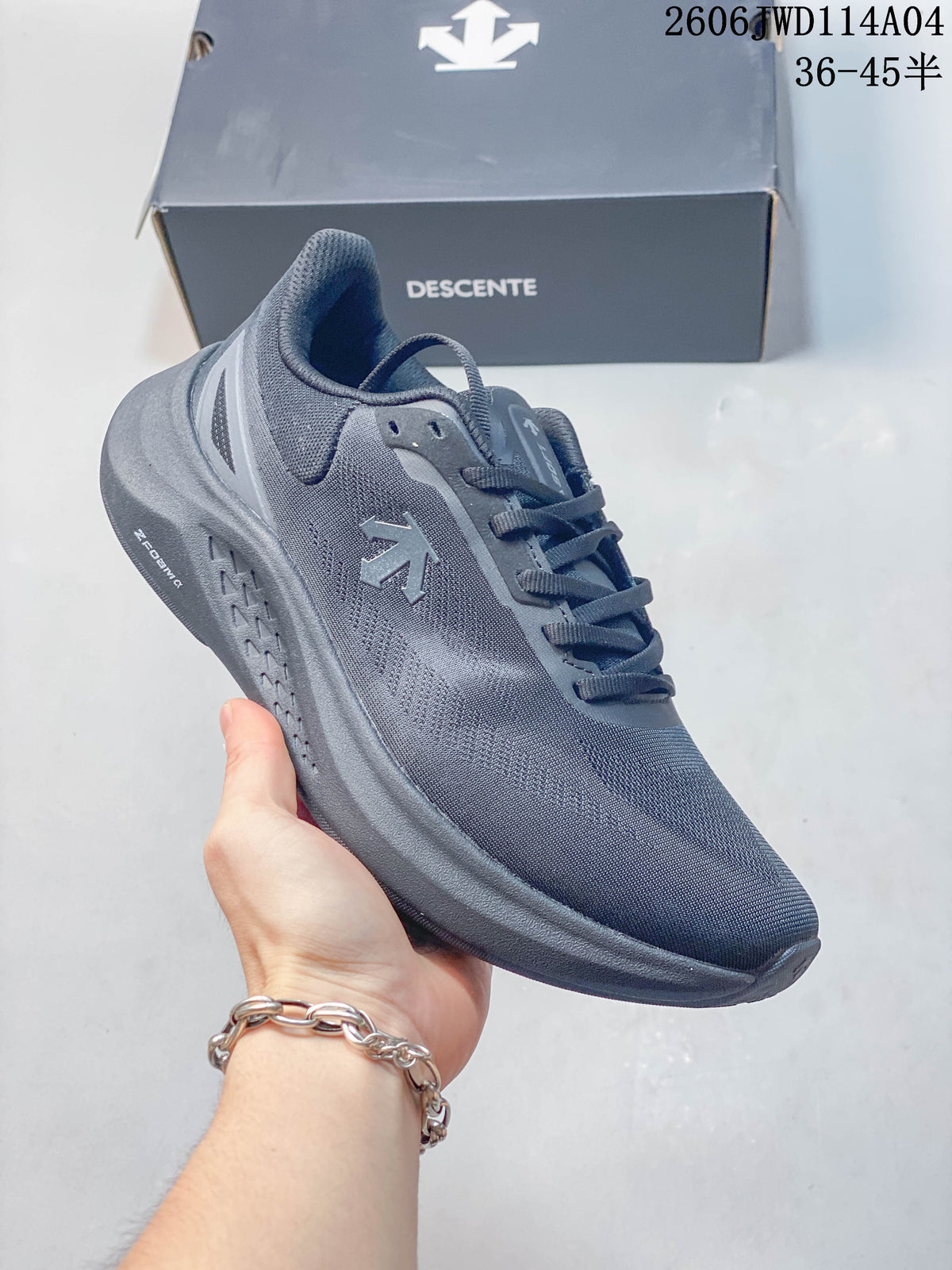 Side view of a blue-gray DESCENTE sneaker with a matching dark sole.
