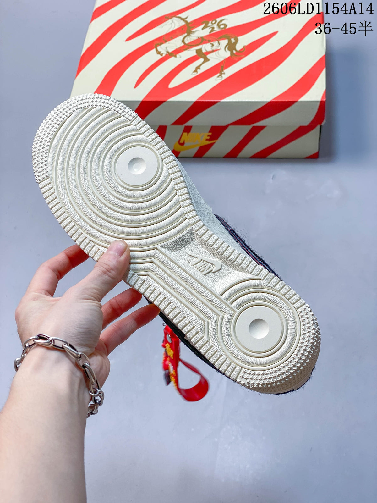 Underside of a cream sneaker showing a circular tread pattern