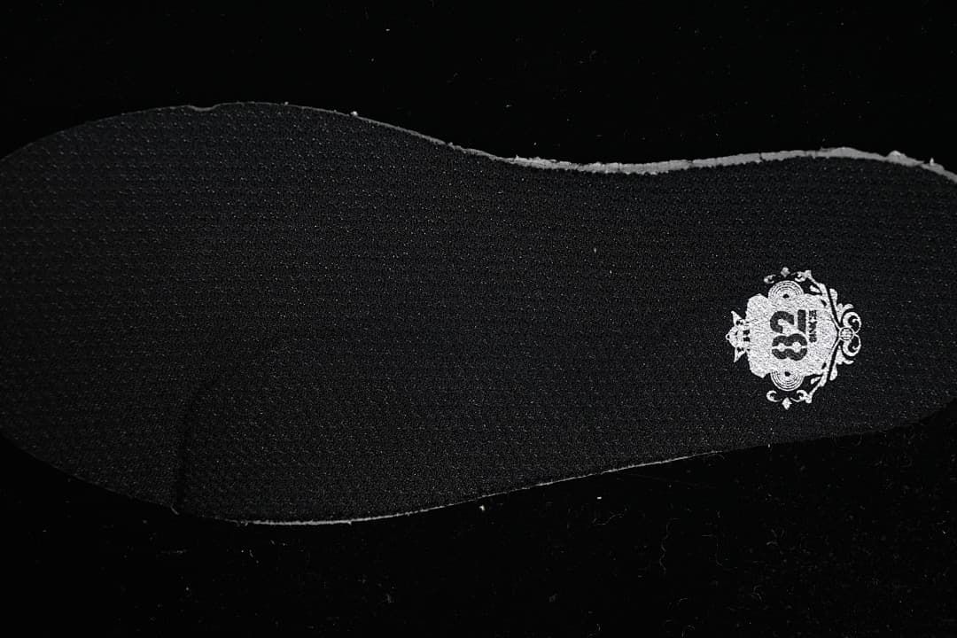 Black insole with a decorative printed emblem