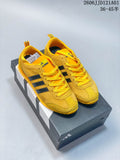 Yellow adidas VS JOG 2.0 low-top sneakers with dark stripes, shown on a shoebox.