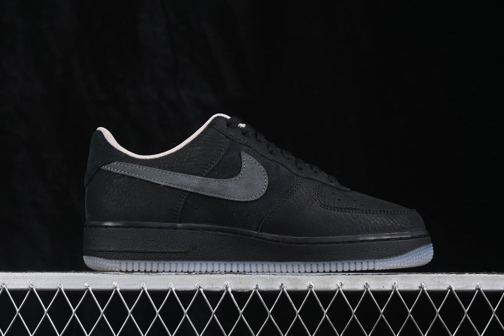 Opposite side profile highlighting the black upper, dark grey Swoosh, and light-colored collar lining.
