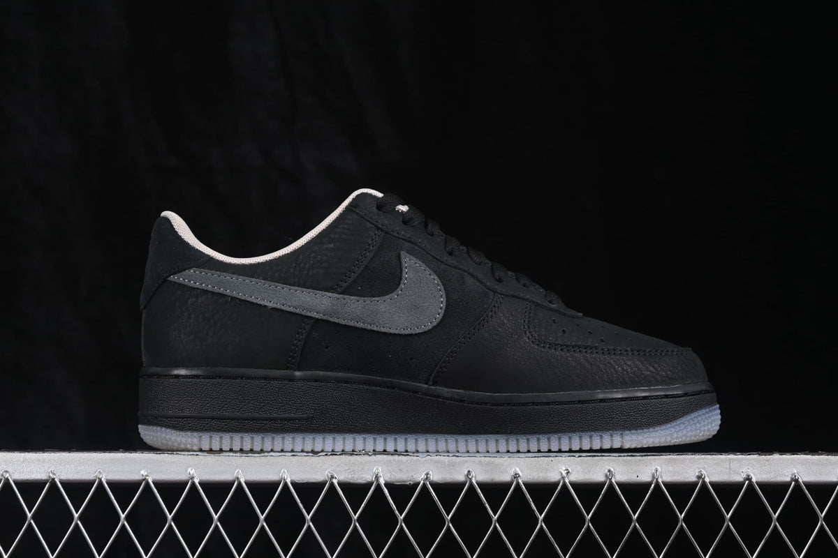 Opposite side profile highlighting the black upper, dark grey Swoosh, and light-colored collar lining.