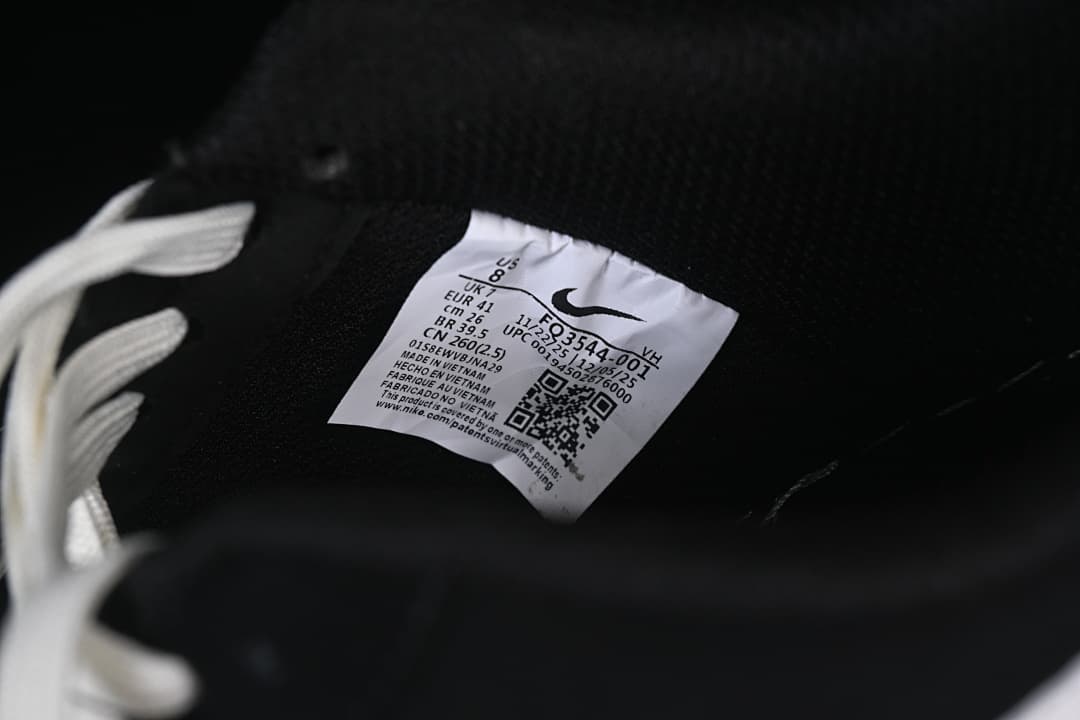 Interior product label showing style code FQ3544-001 and size markings