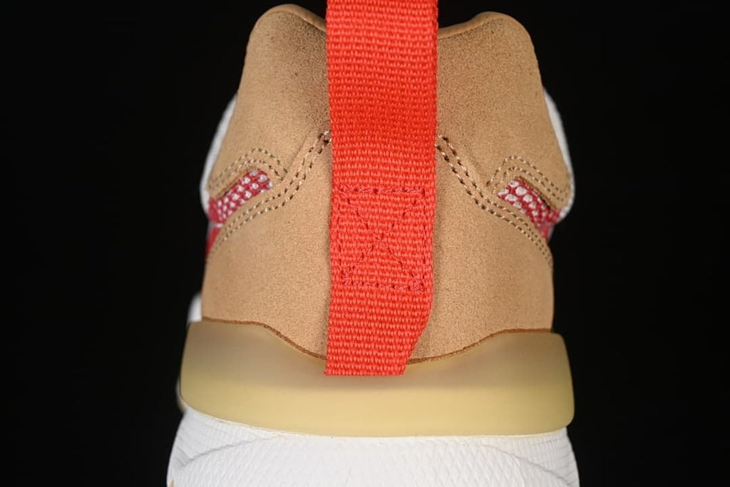 Rear close-up showing tan heel panels, red pull tab, and translucent heel detail
