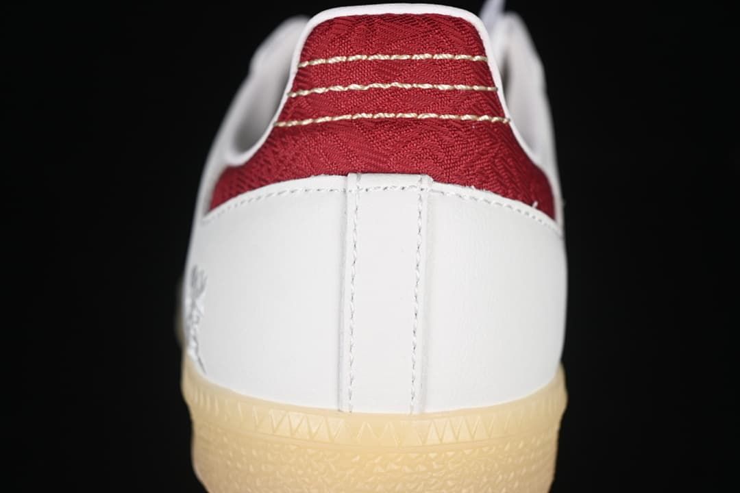 Rear view showing red heel detail, white heel panel, and gum outsole