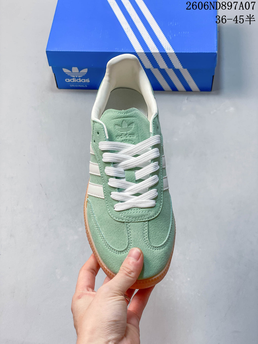 Top view of the mint green adidas Samba with white laces