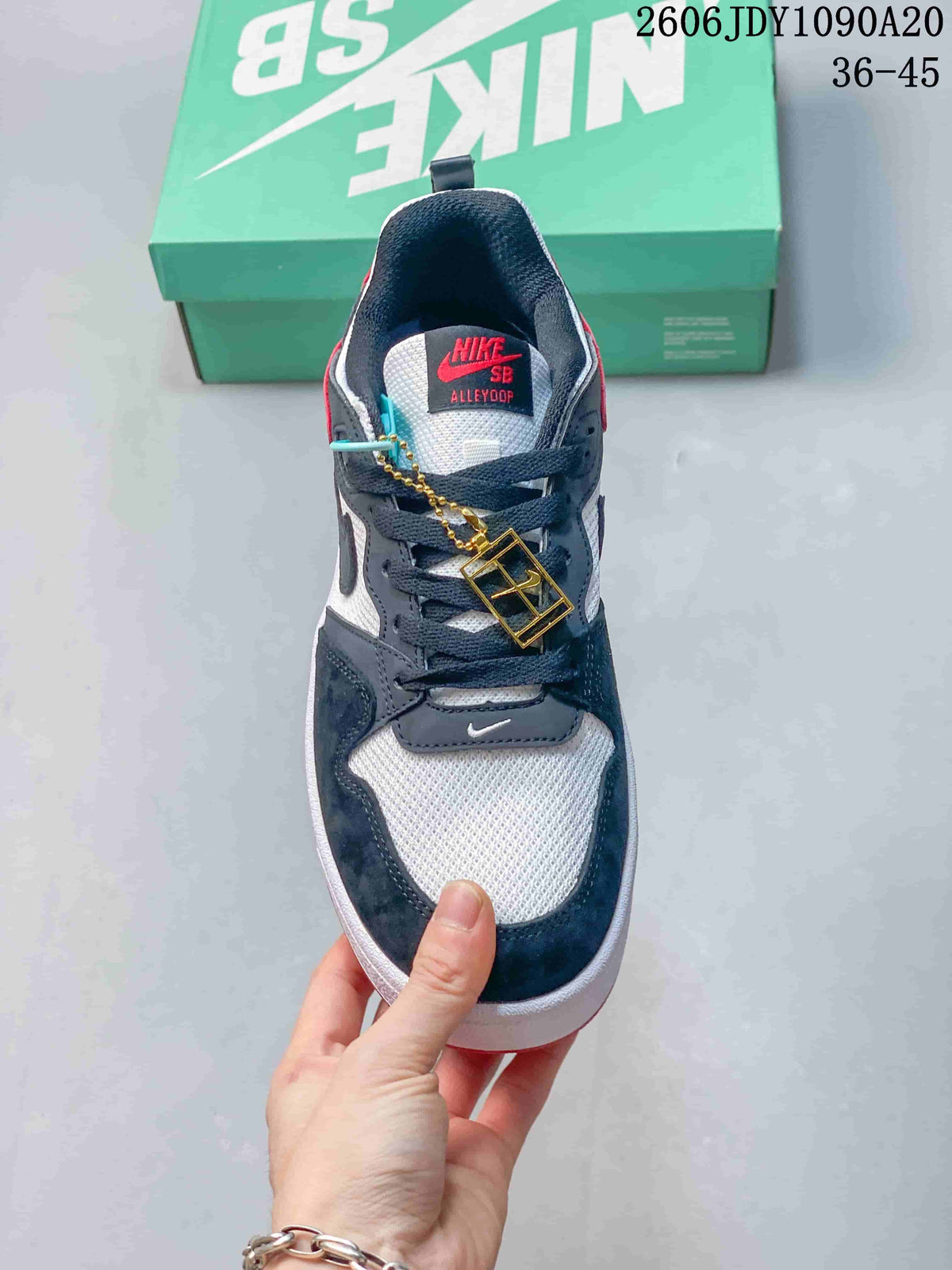 Top view of a Nike SB Alleyoop sneaker with dark laces and a tongue label