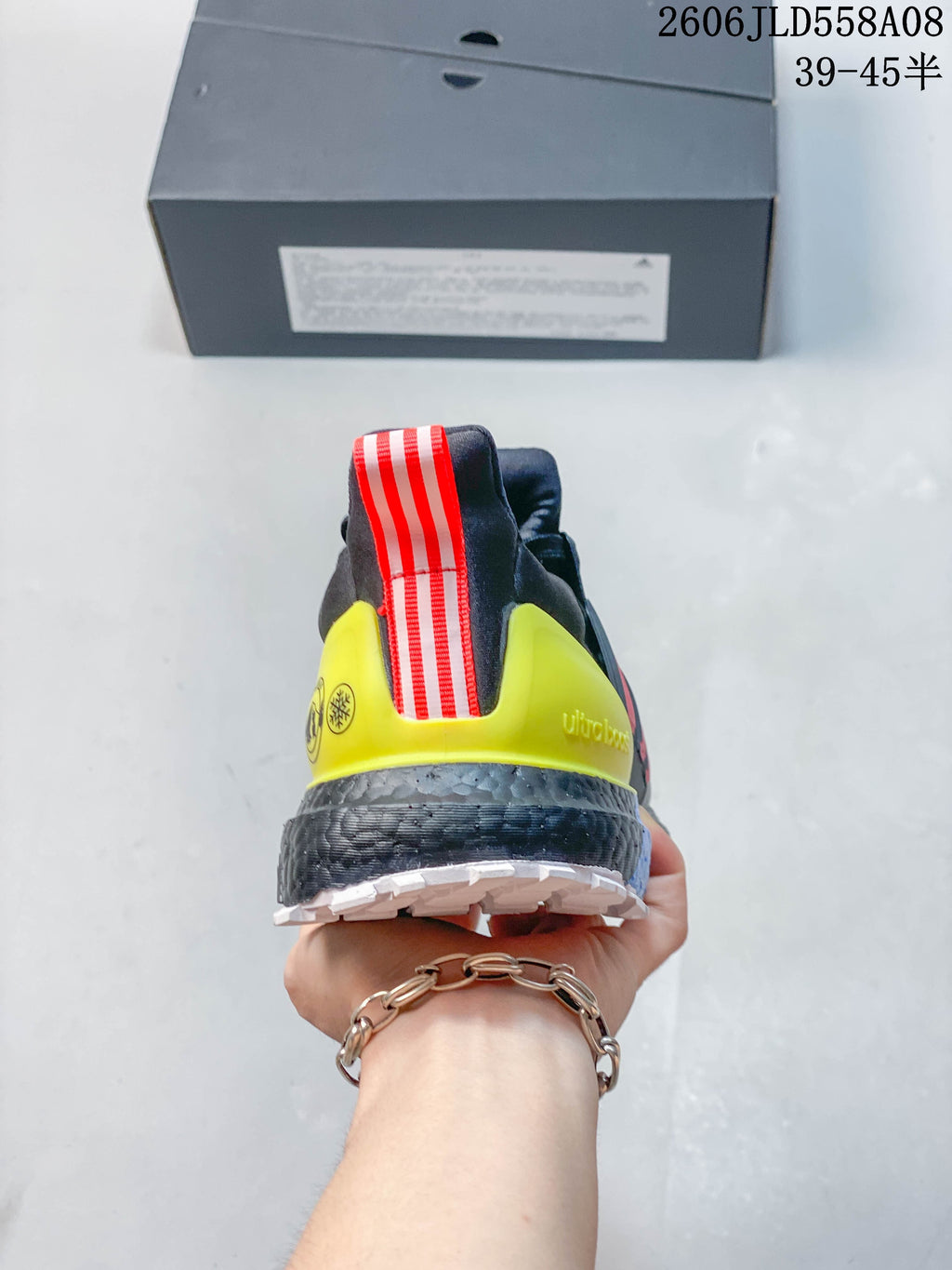 Rear view showing the neon yellow heel piece and red-and-white pull tab