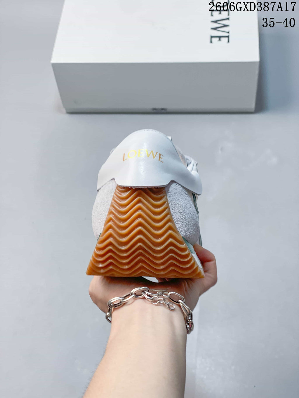 Rear view showing the heel panel and textured gum-colored sole