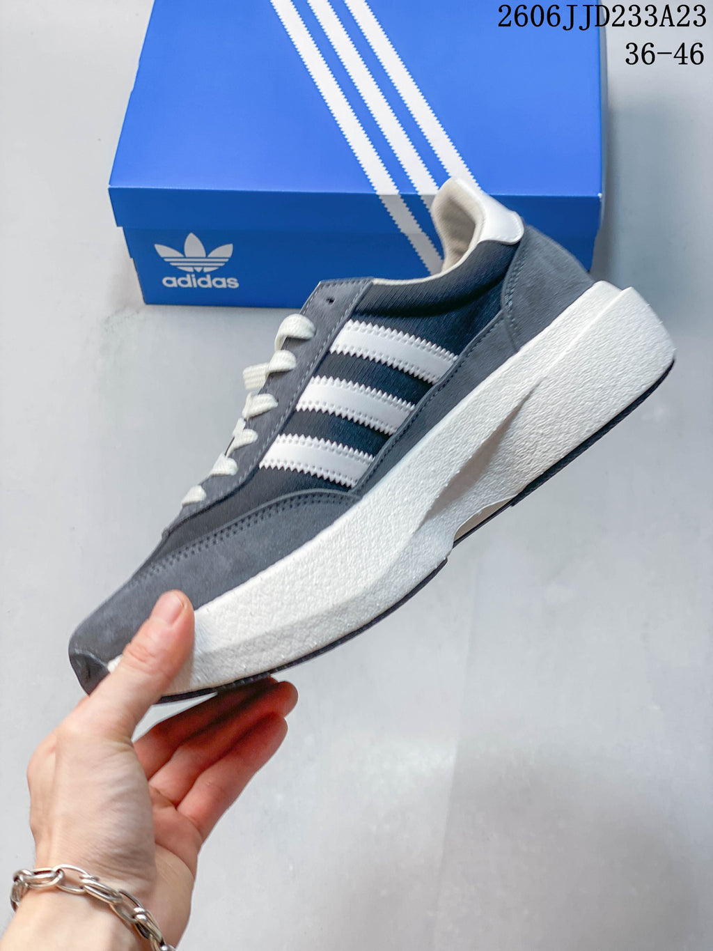 Side view of the gray adidas Originals SL 72 Pro sneaker with white stripes