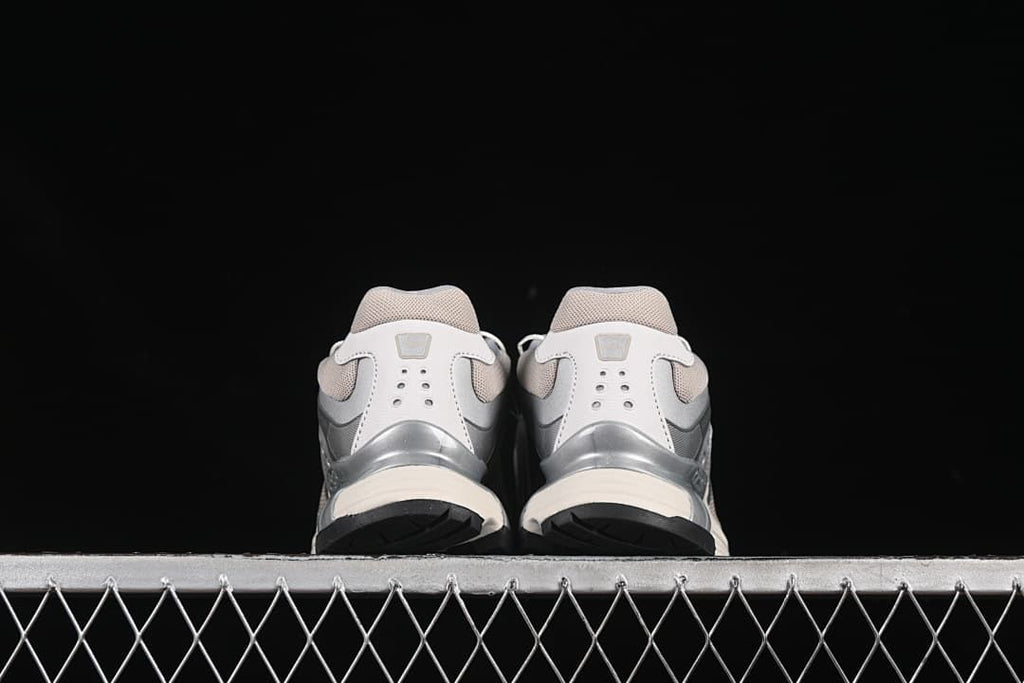 Rear view of the pair showing the heel counters and outsoles.