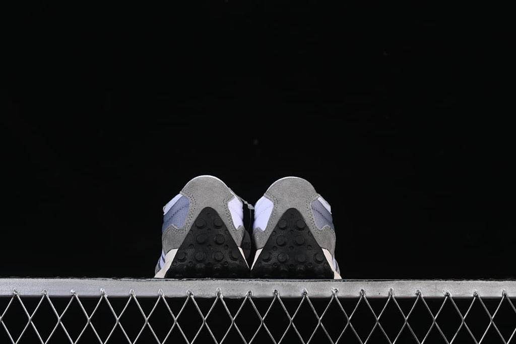 Rear view of the pair showing the black outsole heels.